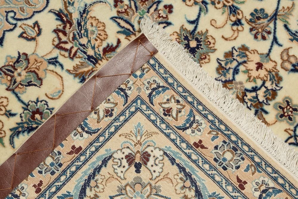 Rug being professionally inspected at the specialist's workshop